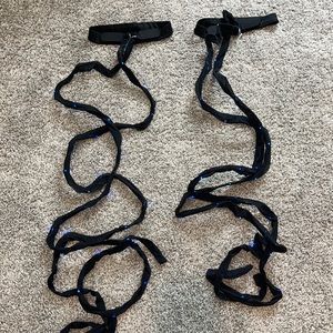 Black leg wraps with blue lights.